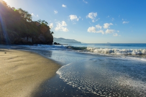 Amankila - black sand beach