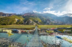 Nepal - suspension bridge with buddhist prayer flags