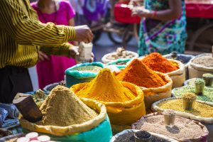 India - Colorful spices powders and herbs in traditional street market in Delhi